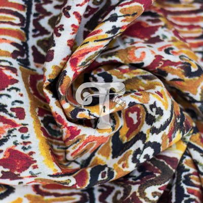 Tecido colorido abstrato com letra T translúcida ao centro