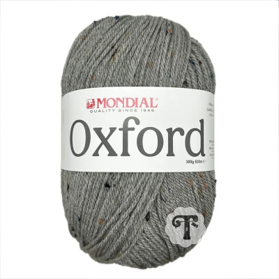 Novelo de lã cinzenta com pontos coloridos e etiqueta MONDIAL Oxford