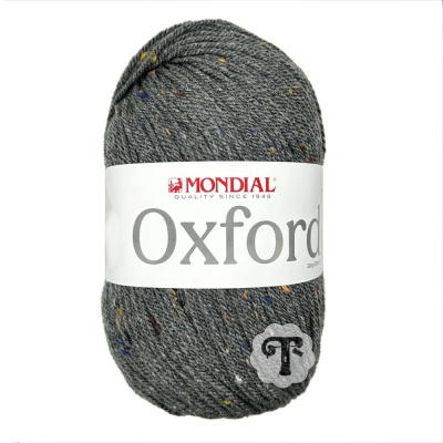Novelo de lã cinza com pontos coloridos da marca MONDIAL, etiqueta branca com texto Oxford