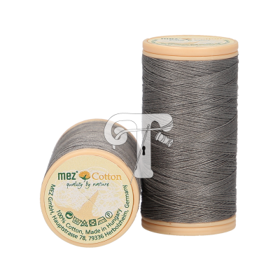 Dois carretéis de linha de algodão cinzenta com rótulos redondos