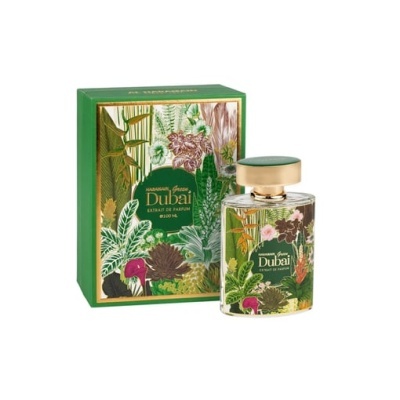 Frasco de perfume com padrão botânico ao lado de caixa verde decorada