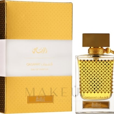 Frasco de perfume dourado com caixa amarela e branca