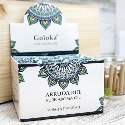 Embalagem quadrada de óleo aromático Goloka com padrão floral e textos visíveis