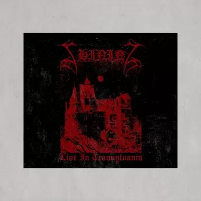 Capa de álbum preto com castelo vermelho e texto gótico 'SHINING Live In Transylvania'