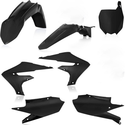 Peças plásticas pretas para moto sobre fundo branco