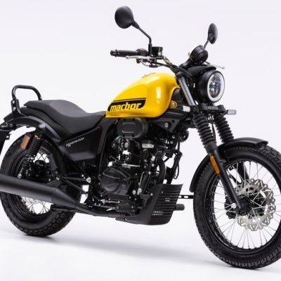 Motocicleta amarela 'MACHOP' com estrutura preta e farol redondo LED