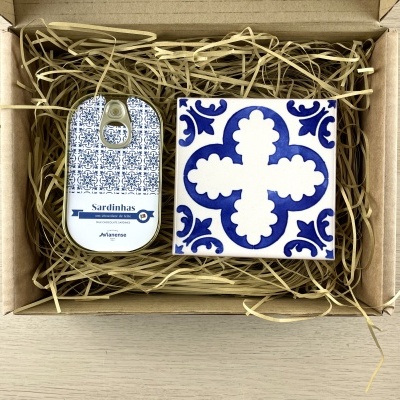 Gift box with ceramic tile and tin can of milk chocolate sardines