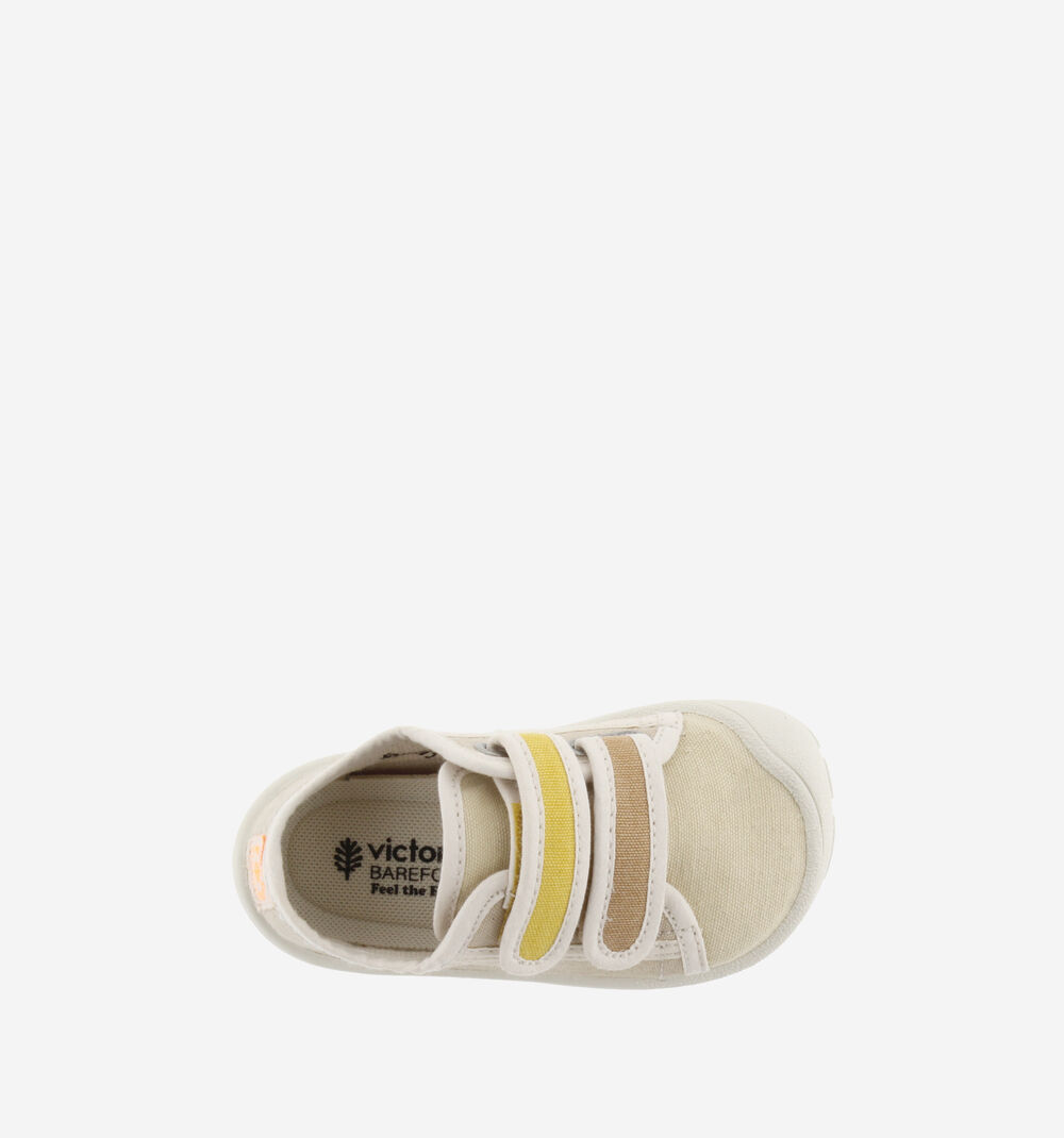 Sapato infantil bege com tiras de velcro amarelo e castanho e texto no interior.
