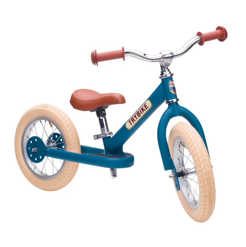 Bicicleta de treino azul escuro com pneus creme e detalhes castanhos