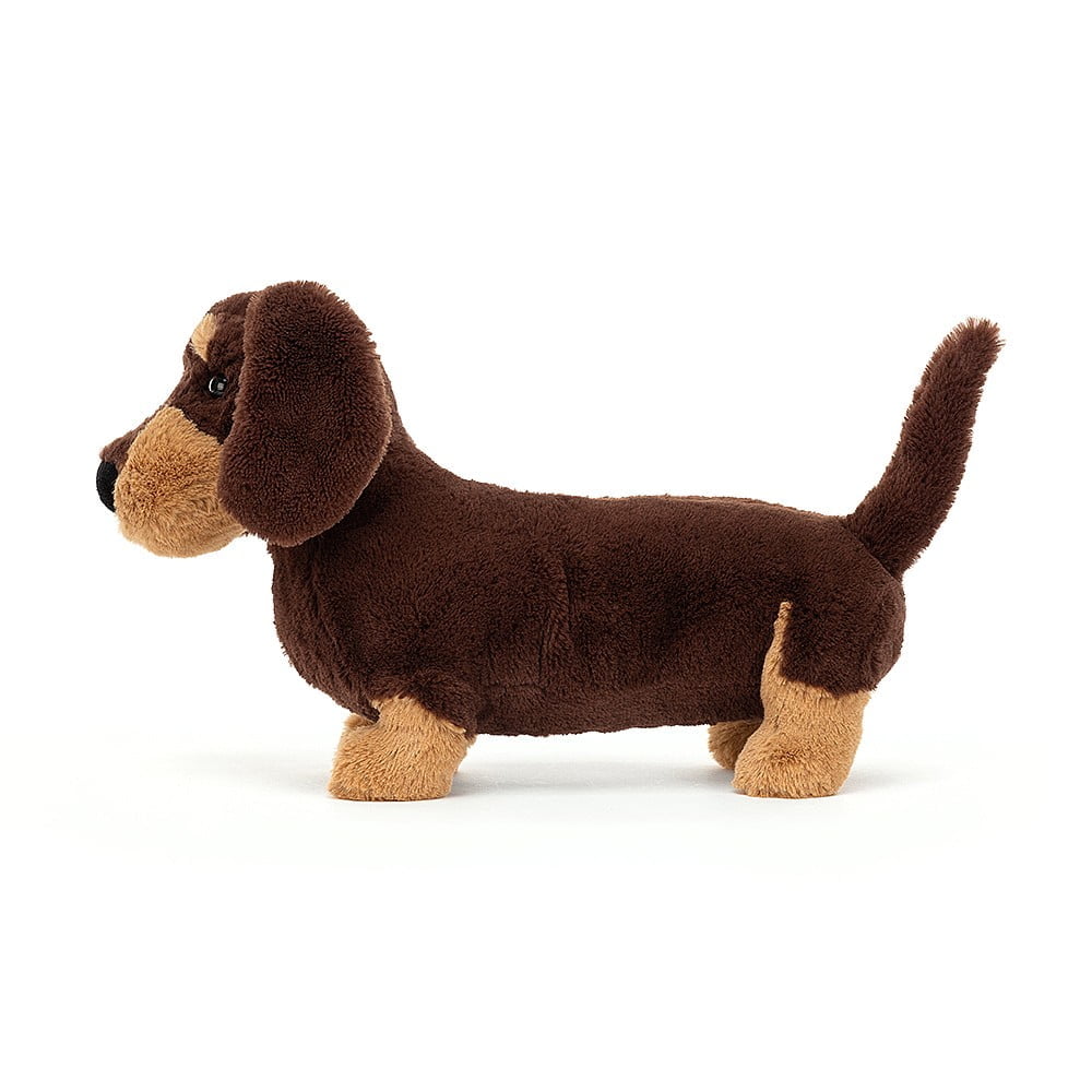 Pelúcia de cão dachshund castanho escuro e claro com textura macia