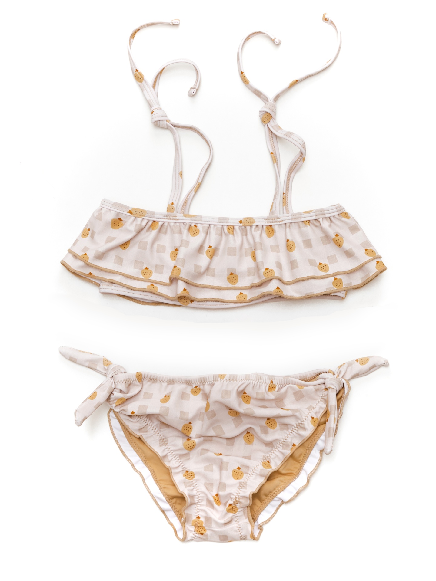 Biquíni infantil bege com estampado de abacaxis amarelos e laços laterais