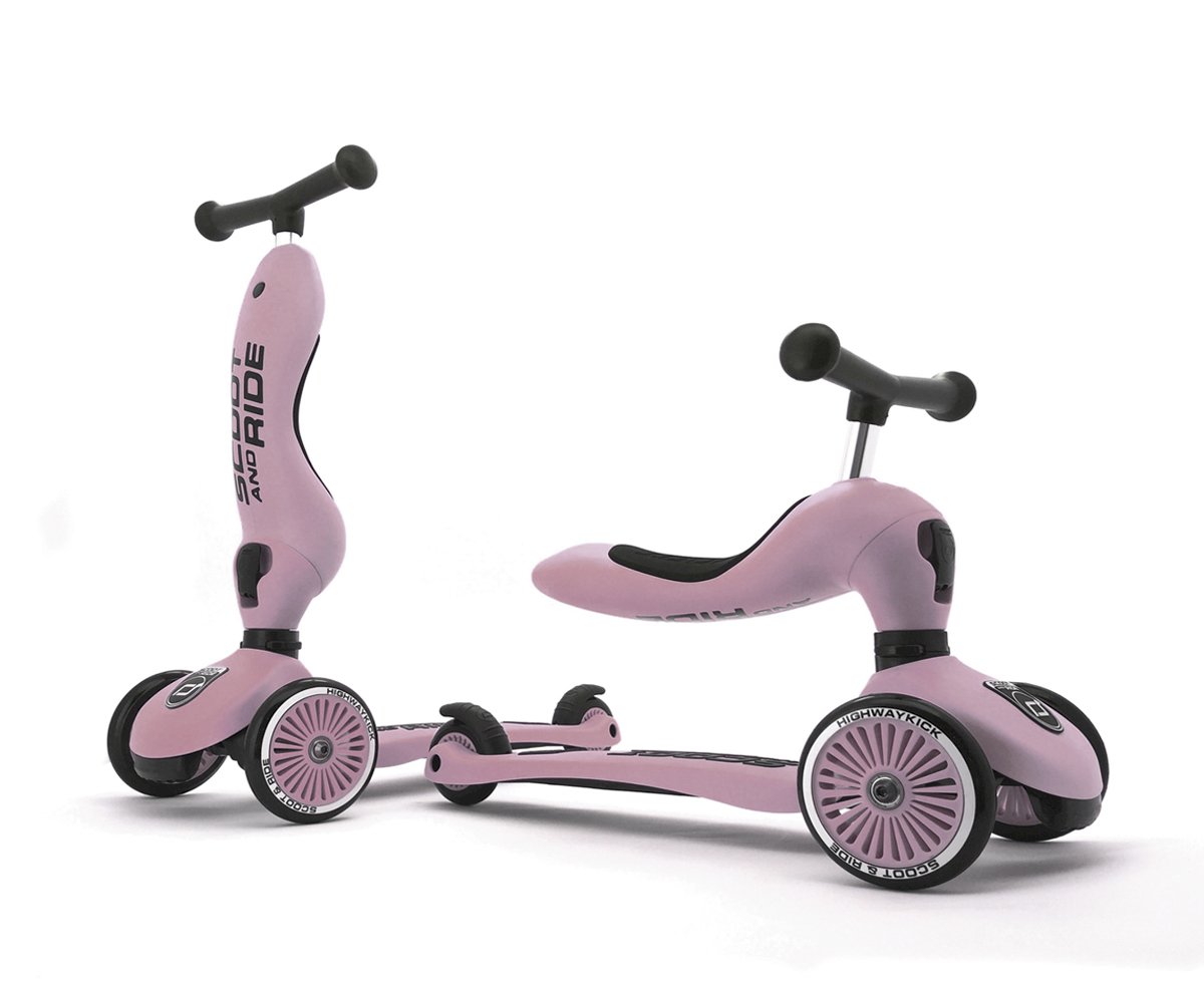 Patinete infantil rosa com três rodas e guiador preto