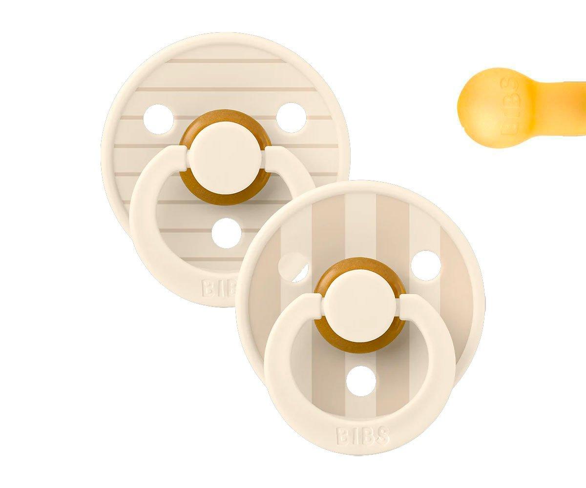 Duas chupetas redondas brancas e bege com design listrado