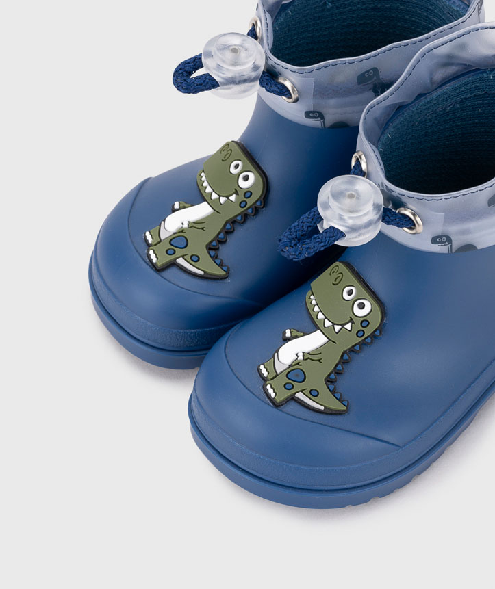 Botas de borracha azuis para criança com dinossauro verde e cordão azul