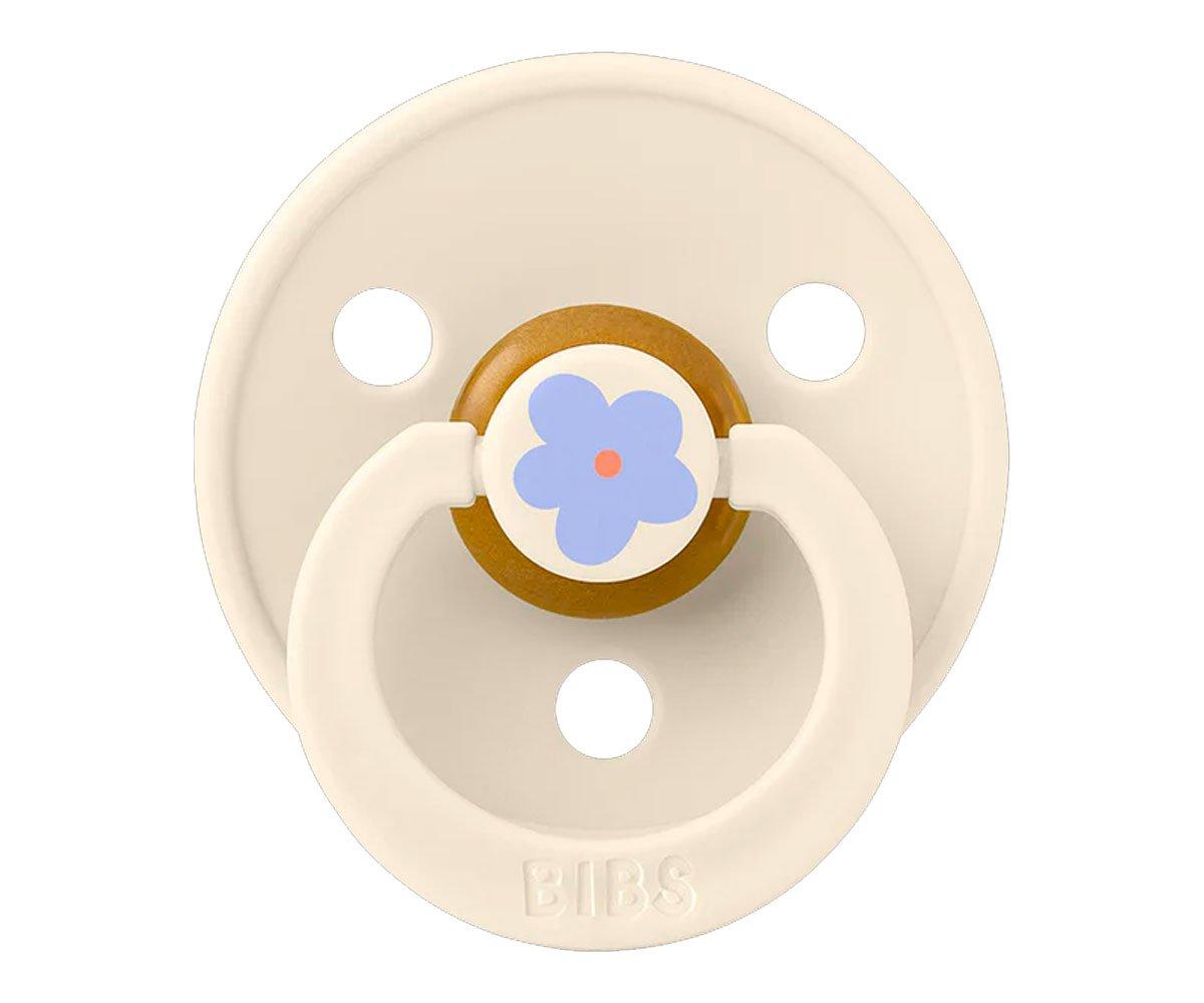 Chupeta redonda creme da marca BIBS com desenho de flor azul