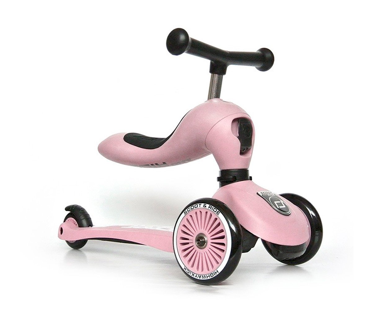 Patinete infantil rosa com três rodas e guiador preto
