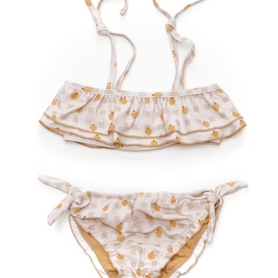 Biquíni infantil bege com estampado de abacaxis amarelos e laços laterais