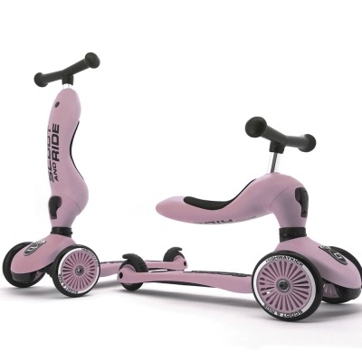 Patinete infantil rosa com três rodas e guiador preto