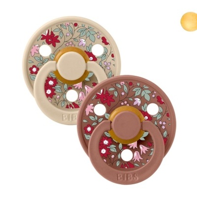 Dois biberões BIBS beige e castanho com flores coloridas e orifícios circulares em fundo branco