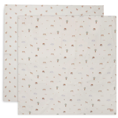 Lençóis bege claro com padrão de animais e árvores