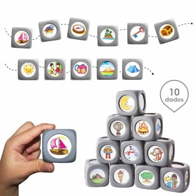 Dados cinzentos com imagens coloridas variadas, incluindo barco rosa, sol, lua, fogo, crianças e objetos diversos.