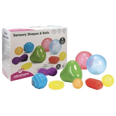 Conjunto de bolas e formas sensoriais coloridas com caixa edushape