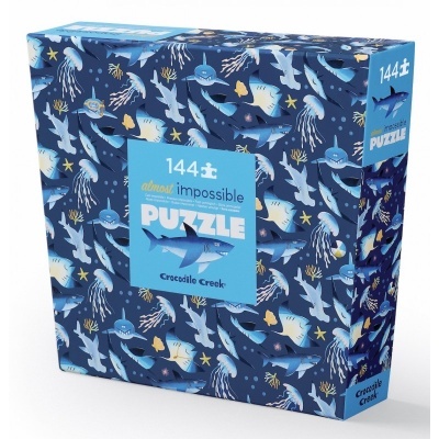 caixa de puzzle azul com ilustracões de tubarões e texto '144 pcs almost impossible PUZZLE'