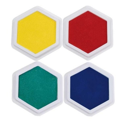 Quatro almofadas de carimbo hexagonais coloridas