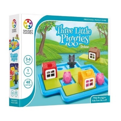 Embalagem do jogo Three Little Piggies Deluxe com figuras de porquinhos, casas coloridas e lobo num tabuleiro azul.