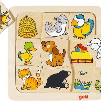 Puzzle de madeira com imagens de animais e objetos de quinta coloridos