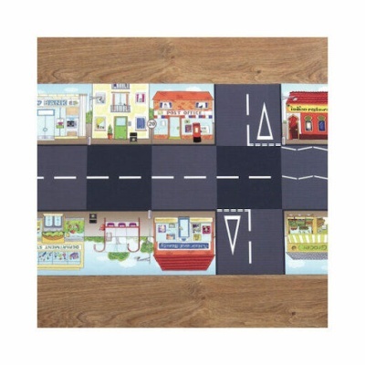 Tapete infantil com padrão de cidade com ruas e edifícios coloridos