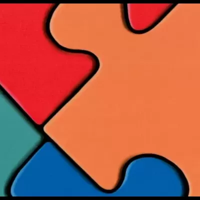 Peças de puzzle coloridas em vermelho, laranja, azul, roxo e verde