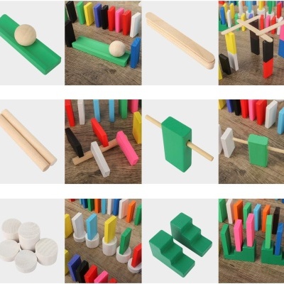 Peças de dominó coloridas em madeira com suportes verdes e acessórios diversos