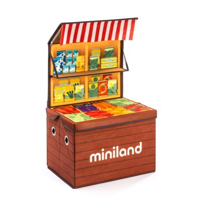 Brinquedo de banca de feira 'miniland' com frutas e legumes ilustrados coloridos