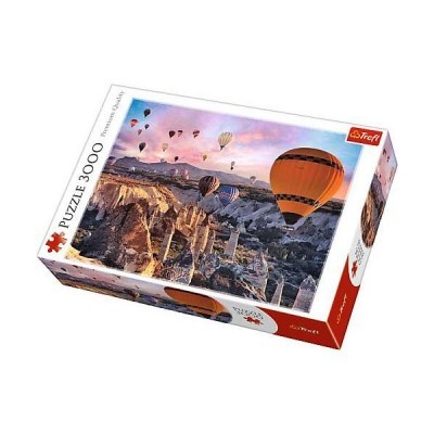 Caixa de puzzle Trefl 3000 peças com imagem de balões de ar quente sobre formação rochosa ao pôr do sol