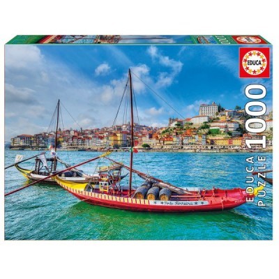 Caixa de puzzle EDUCA 1000 peças com imagem de barco tradicional português no mar e cidade ao fundo