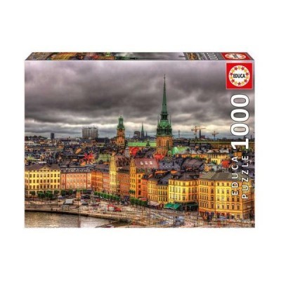 Puzzle EDUCA 1000 peças com cidade europeia e torres altas sob céu nublado