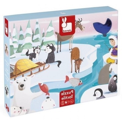 Caixa de puzzle com ilustração polar e animais em ambiente nevado.