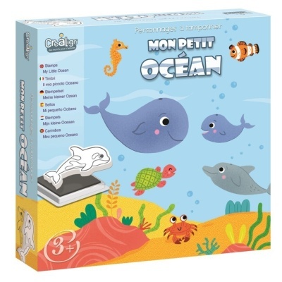 Conjunto de carimbos de madeira com tema oceano ilustrado com animais marinhos, numa caixa azul com núcleo de texto em várias línguas.