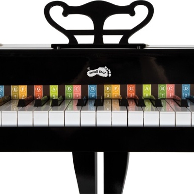 Piano de brinquedo preto com teclas coloridas e suporte para partituras