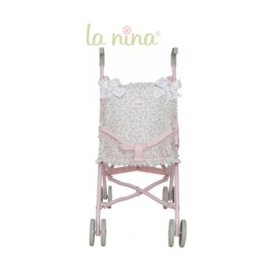 Carrinho de boneca cor de rosa com tecido floral e laços brancos