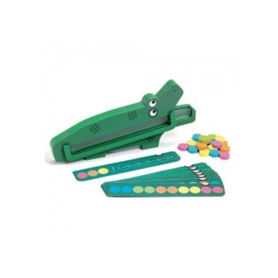 Brinquedo de plástico verde em forma de crocodilo com peças e discos coloridos