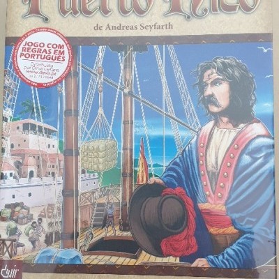 Embalagem do jogo de tabuleiro Puerto Rico com ilustração de homem e navio