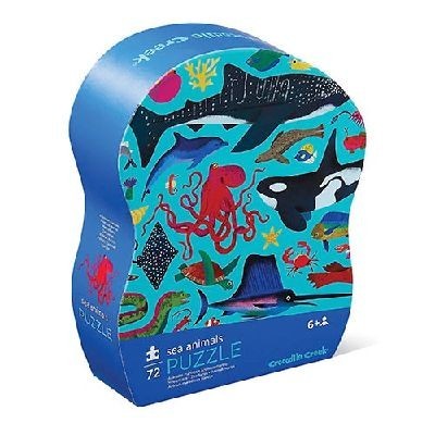 Embalagem de puzzle azul com ilustrações de animais marinhos e texto '72 sea animals PUZZLE 6+ crocodile creek'.