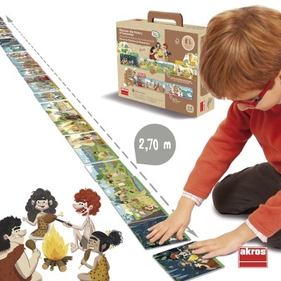 Criança a montar linha de cartas ilustradas pré-históricas com caixa de transporte