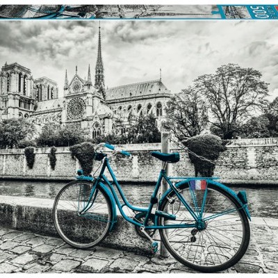 Caixa de puzzle Educa com imagem de bicicleta azul em frente a catedral em preto e branco.
