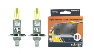 Dois bulbos halógenos automóveis ao lado da embalagem com texto de segurança e marca Narva.