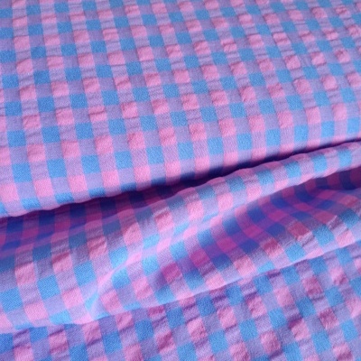 Tela de algodón con cuadros rosa y azul