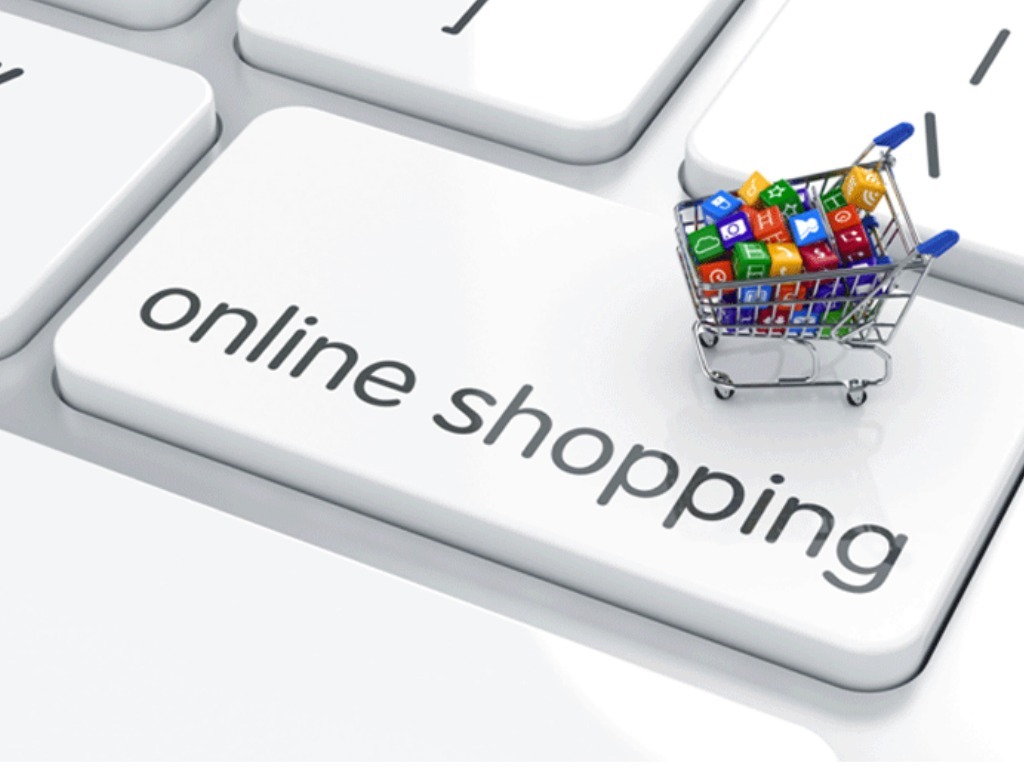 Tecla de teclado branca com texto online shopping e mini carrinho de compras com peças coloridas