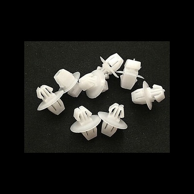 Presilhas brancas de plástico para automóvel sobre fundo preto